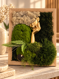 Tableau artisanal Visages de Nature associant visage sculpté et végétaux stabilisés.