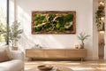 Tableau végétal stabilisé horizontal de 125 × 60 cm, composé de mousses, lichens et feuillages verts dans un cadre en bois texturé, avec une branche bois flotté centrale